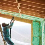 Male,Builder,Insulating,Wooden,Frame,House.,Man,Worker,Spraying,Polyurethane
