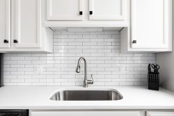 Kitchen,Sink,Detail,Shot,With,A,Subway,Tile,Backsplash,,Granite