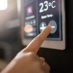 Smart,Home,System,,Wall,And,Woman,Hands,With,Digital,App